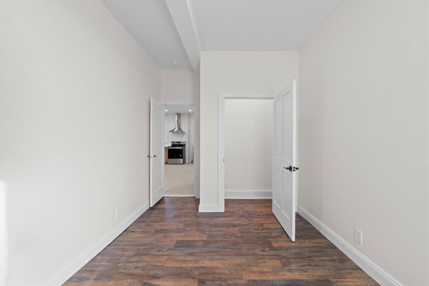 Empty room, Interior, Kitchen, Stainless Steel Appliances, Wood Texture Flooring