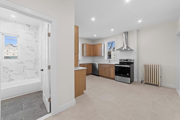 Interior, Kitchen, Marble Walls, Recessed Lighting, Stainless Steel Appliances