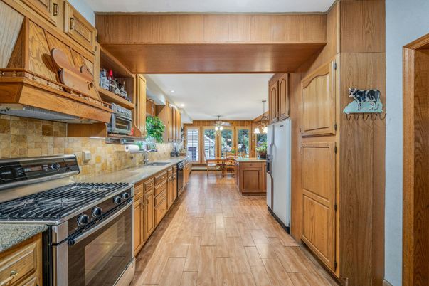 Dining room, Interior, Kitchen, Pendant Lights, Stainless Steel Appliances, Wood Texture Flooring