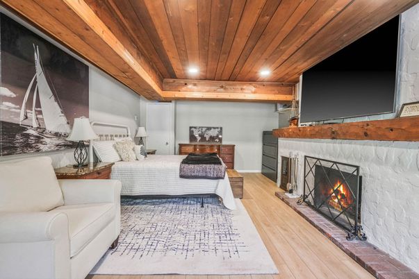 Bedroom, Fireplace, Interior, Recessed Lighting, Wooden Ceilings, Wood Texture Flooring