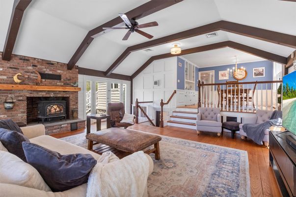 Chandelier, Fireplace, Interior, Living room, Stone Walls, Wooden Beams, Wood Texture Flooring