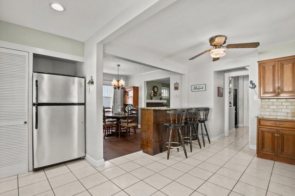 Chandelier, Dining room, Interior, Kitchen, Recessed Lighting, Stainless Steel Appliances, Wood Texture Flooring