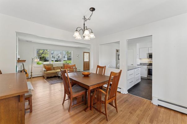 Chandelier, Dining room, Interior, Kitchen, Living room, Stainless Steel Appliances, Wood Texture Flooring