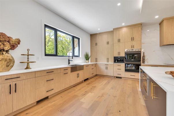 Interior, Kitchen, Marble Walls, Recessed Lighting, Stainless Steel Appliances, Wood Texture Flooring