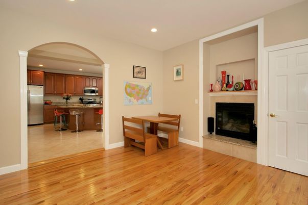 Dining room, Fireplace, Interior, Kitchen, Recessed Lighting, Stainless Steel Appliances, Wood Texture Flooring