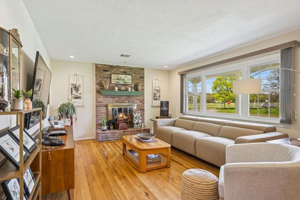 Fireplace, Interior, Living room, Recessed Lighting, Stone Walls, Wood Texture Flooring