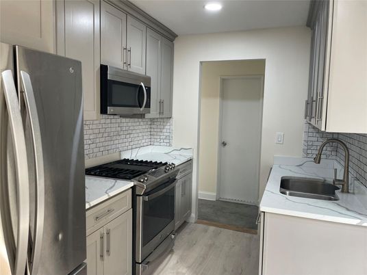 Interior, Kitchen, Recessed Lighting, Stainless Steel Appliances, Wood Texture Flooring