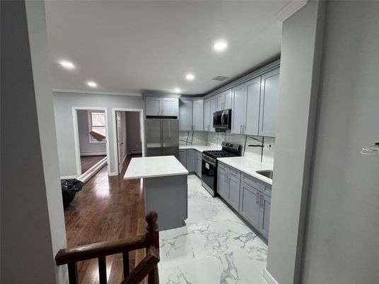 Interior, Kitchen, Marble, Recessed Lighting, Stainless Steel Appliances, Wood Texture Flooring