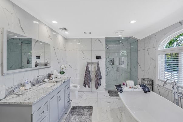 Bathroom, Dual Sink Vanities, Glass Shower, Interior, Marble, Marble Walls, Recessed Lighting