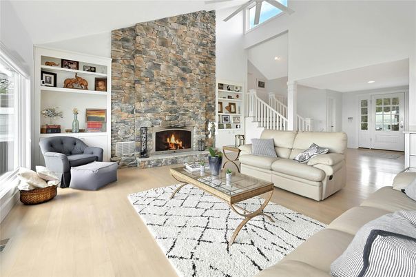 Fireplace, Interior, Living room, Recessed Lighting, Stone Walls, Wood Texture Flooring