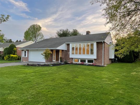 Attached, Backyard, Exterior, Facade, Brick Facade, Split Level