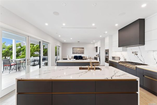 Interior, Kitchen, Marble Walls, Pendant Lights, Recessed Lighting, Stainless Steel Appliances, Wood Texture Flooring