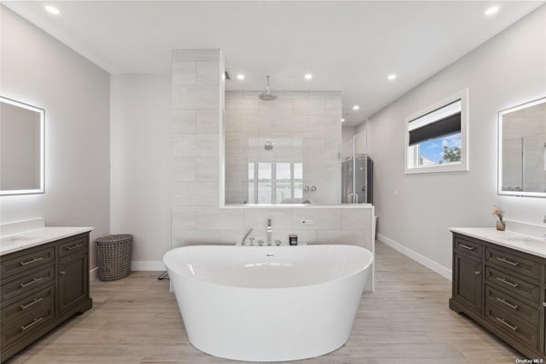 Bathroom, Dual Sink Vanities, Free Standing Baths, Glass Shower, Interior, Recessed Lighting, Wood Texture Flooring