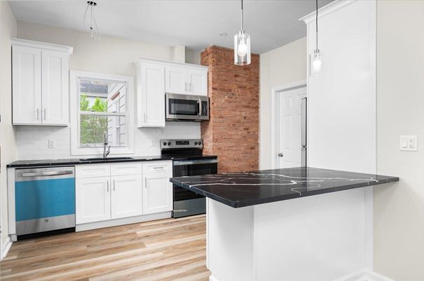 Interior, Kitchen, Pendant Lights, Stainless Steel Appliances, Stone Walls, Wood Texture Flooring