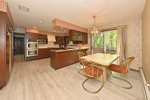 Chandelier, Dining room, Interior, Kitchen, Recessed Lighting, Stainless Steel Appliances, Wood Texture Flooring