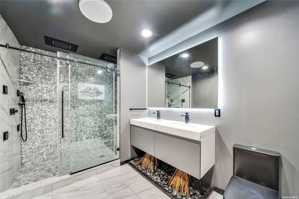 Bathroom, Dual Sink Vanities, Glass Shower, Interior, Marble, Marble Walls, Recessed Lighting
