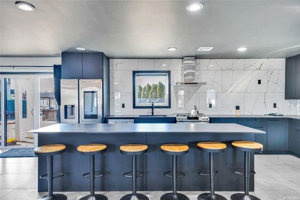 Interior, Kitchen, Marble Walls, Recessed Lighting, Stainless Steel Appliances