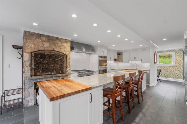 Fireplace, Interior, Kitchen, Recessed Lighting, Stainless Steel Appliances, Stone Walls
