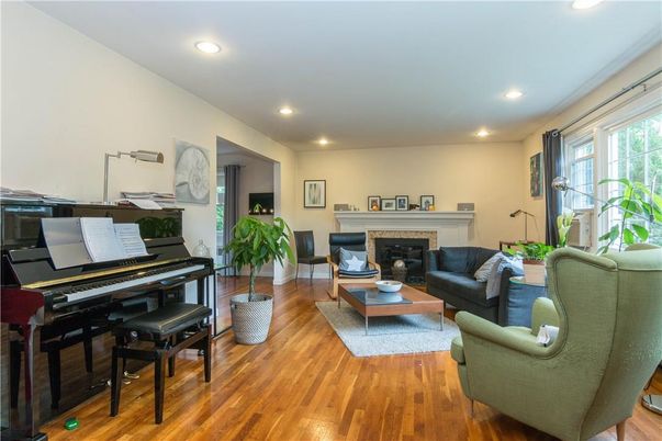 Fireplace, Interior, Living room, Piano, Recessed Lighting, Wood Texture Flooring