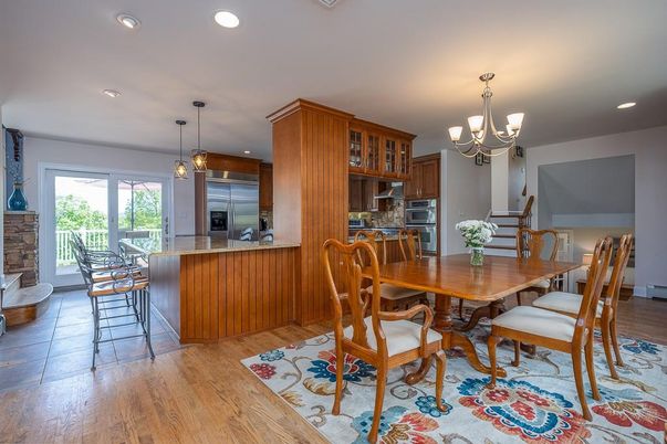 Chandelier, Dining room, Interior, Kitchen, Pendant Lights, Recessed Lighting, Stainless Steel Appliances, Wood Texture Flooring