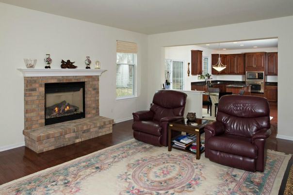 Fireplace, Interior, Kitchen, Living room, Pendant Lights, Recessed Lighting, Stainless Steel Appliances, Wood Texture Flooring