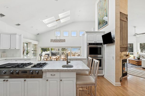 Fireplace, Interior, Kitchen, Recessed Lighting, Stainless Steel Appliances, Wood Texture Flooring