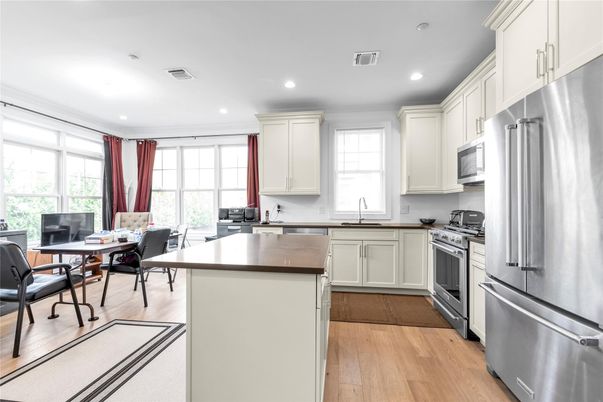 Dining room, Interior, Kitchen, Recessed Lighting, Stainless Steel Appliances, Wood Texture Flooring