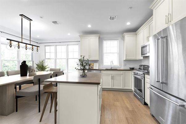 Dining room, Interior, Kitchen, Pendant Lights, Recessed Lighting, Stainless Steel Appliances, Wood Texture Flooring