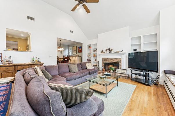 Chandelier, Dining room, Fireplace, Interior, Living room, Pendant Lights, Recessed Lighting, Wood Texture Flooring