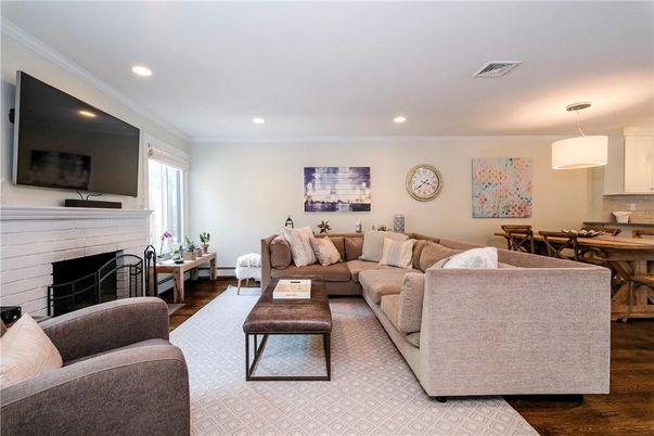 Dining room, Fireplace, Interior, Living room, Pendant Lights, Recessed Lighting, Wood Texture Flooring