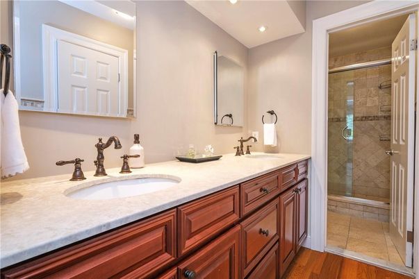 Bathroom, Dual Sink Vanities, Glass Shower, Interior, Recessed Lighting, Wood Texture Flooring