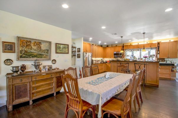 Dining room, Interior, Kitchen, Pendant Lights, Recessed Lighting, Stainless Steel Appliances, Wood Texture Flooring