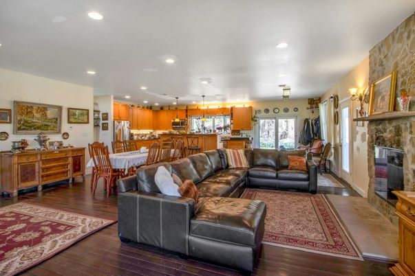 Dining room, Fireplace, Interior, Kitchen, Living room, Pendant Lights, Recessed Lighting, Stainless Steel Appliances, Wood Texture Flooring