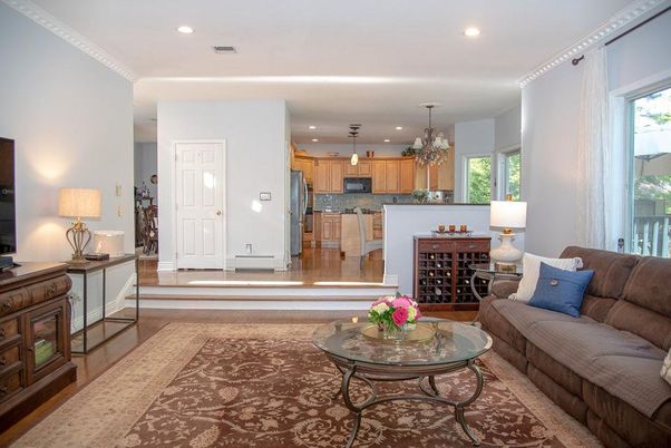 Chandelier, Interior, Kitchen, Living room, Pendant Lights, Recessed Lighting, Stainless Steel Appliances, Wood Texture Flooring