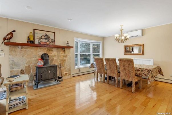 Chandelier, Dining room, Fireplace, Interior, Recessed Lighting, Stone Walls, Wood Texture Flooring