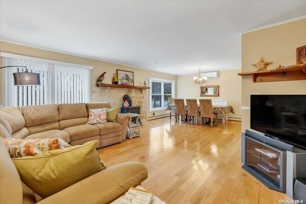 Chandelier, Dining room, Fireplace, Interior, Living room, Stone Walls, Wood Texture Flooring