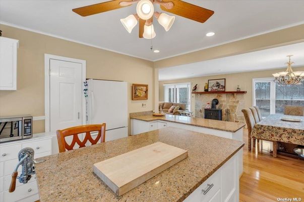 Chandelier, Dining room, Fireplace, Interior, Recessed Lighting, Wood Texture Flooring
