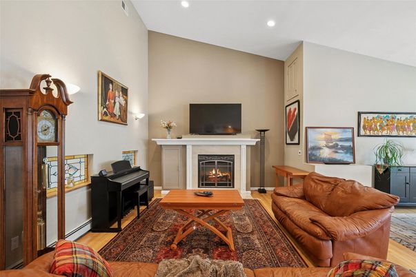 Fireplace, Interior, Living room, Piano, Recessed Lighting, Wood Texture Flooring