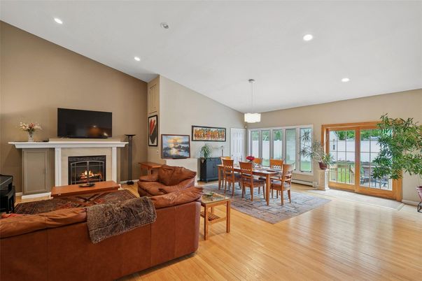 Dining room, Fireplace, Interior, Living room, Pendant Lights, Recessed Lighting, Wood Texture Flooring