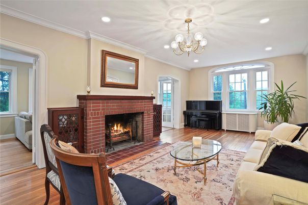 Chandelier, Fireplace, Interior, Living room, Piano, Recessed Lighting, Wood Texture Flooring