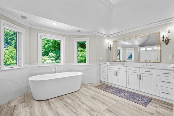 Bathroom, Dual Sink Vanities, Free Standing Baths, Interior, Marble Walls, Recessed Lighting, Wood Texture Flooring