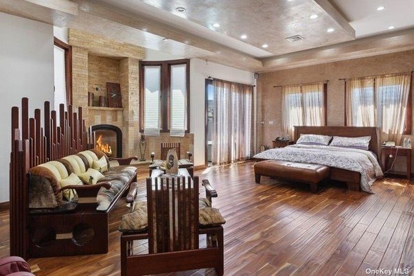 Bedroom, Fireplace, Interior, Recessed Lighting, Stone Walls, Wood Texture Flooring