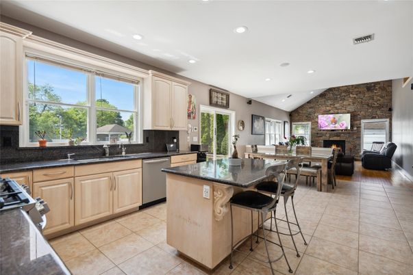 Dining room, Fireplace, Interior, Kitchen, Living room, Recessed Lighting, Stainless Steel Appliances, Stone Walls