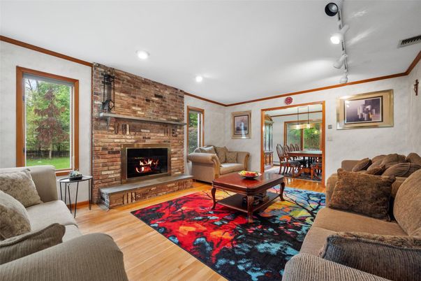 Dining room, Fireplace, Interior, Living room, Pendant Lights, Recessed Lighting, Stone Walls, Wood Texture Flooring