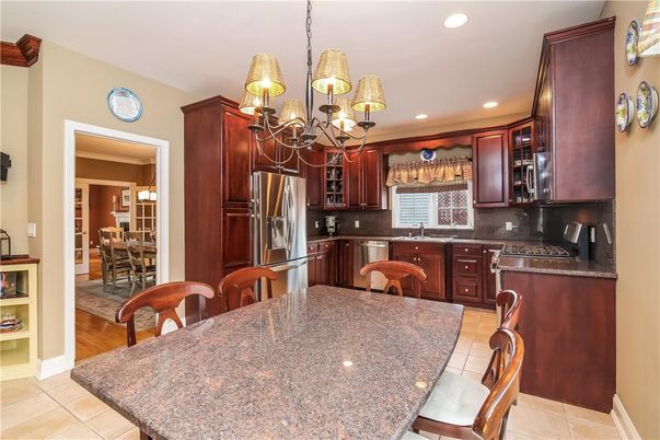 Chandelier, Dining room, Interior, Kitchen, Recessed Lighting, Stainless Steel Appliances, Wood Texture Flooring