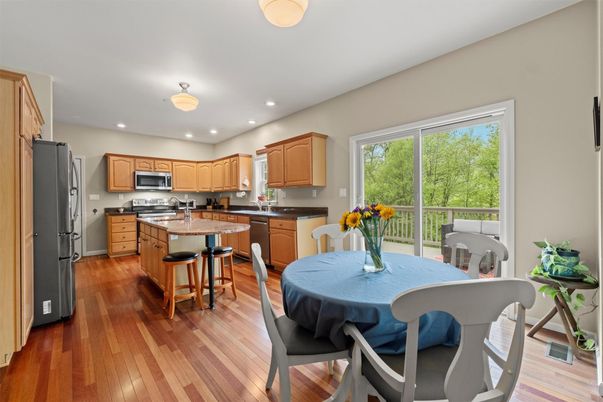 Dining room, Interior, Kitchen, Recessed Lighting, Stainless Steel Appliances, Wood Texture Flooring