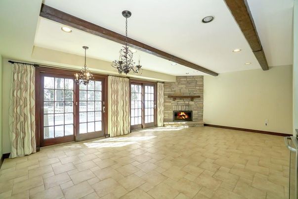 Chandelier, Empty room, Fireplace, Interior, Recessed Lighting, Wooden Beams