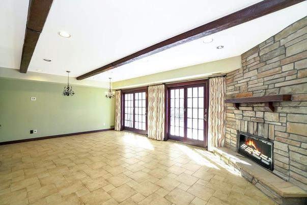 Empty room, Fireplace, Interior, Pendant Lights, Recessed Lighting, Stone Walls, Wooden Beams