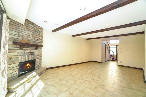 Empty room, Fireplace, Interior, Recessed Lighting, Wooden Beams