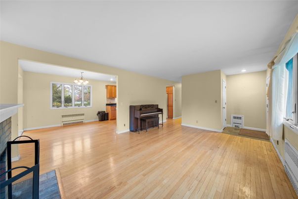 Chandelier, Fireplace, Interior, Piano, Recessed Lighting, Wood Texture Flooring
